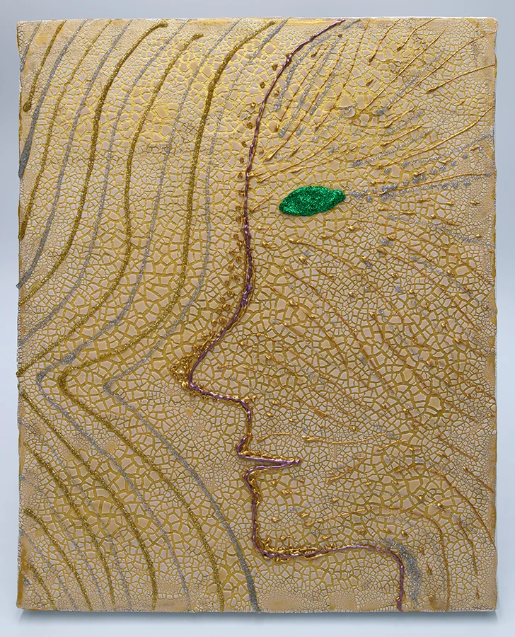 A subtle side profile on a pale cracked surface, with a green eye